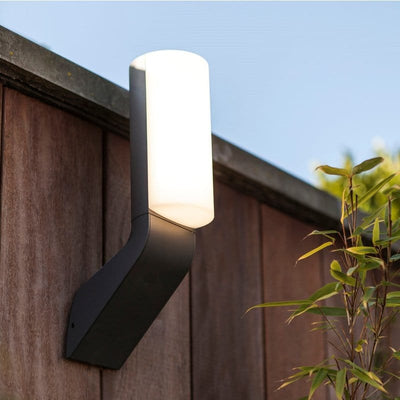 The Lutec Bati outdoor wall light on a fence.